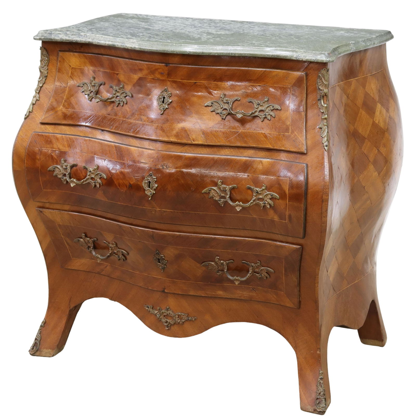 FRENCH STYLE MARBLE-TOP BOMBE COMMODE: French style bombe commode, early 20th c., having shaped marble top, over parquetry case fitted with three drawers, accented with foliate metal mounts, rising on French bracket feet, approx 31.25"h, 3