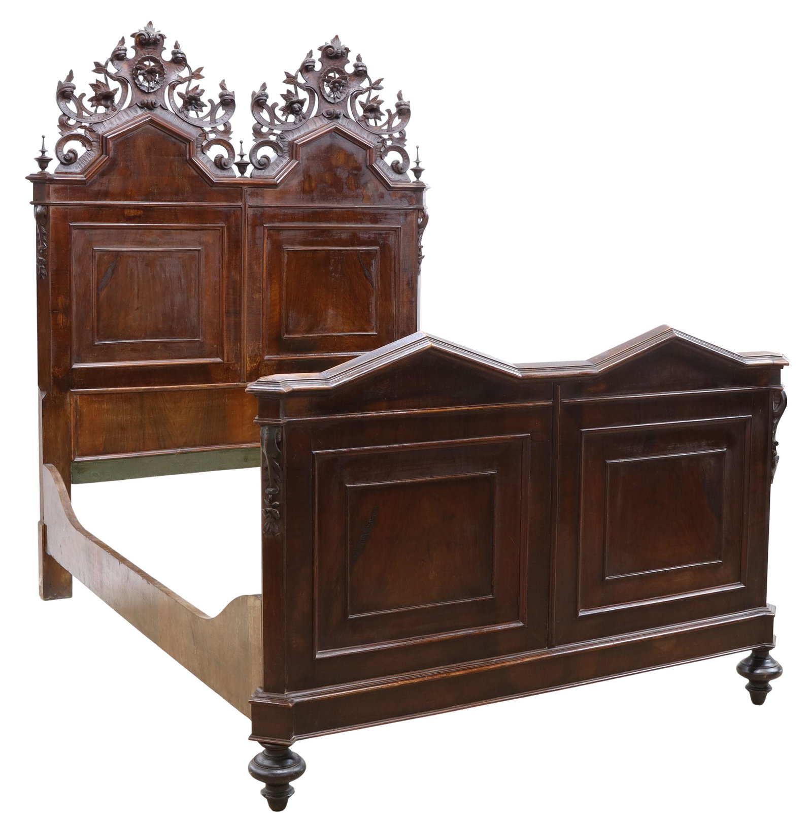 ITALIAN CARVED CREST WALNUT BED, 19TH C.: Italian carved walnut bed, 19th c., carved double crest with scrolling foliates, turned finials, paneled headboard and footboard, rising on tapered turned feet, exterior: approx 80"h, 82.5"l, 63"w, in