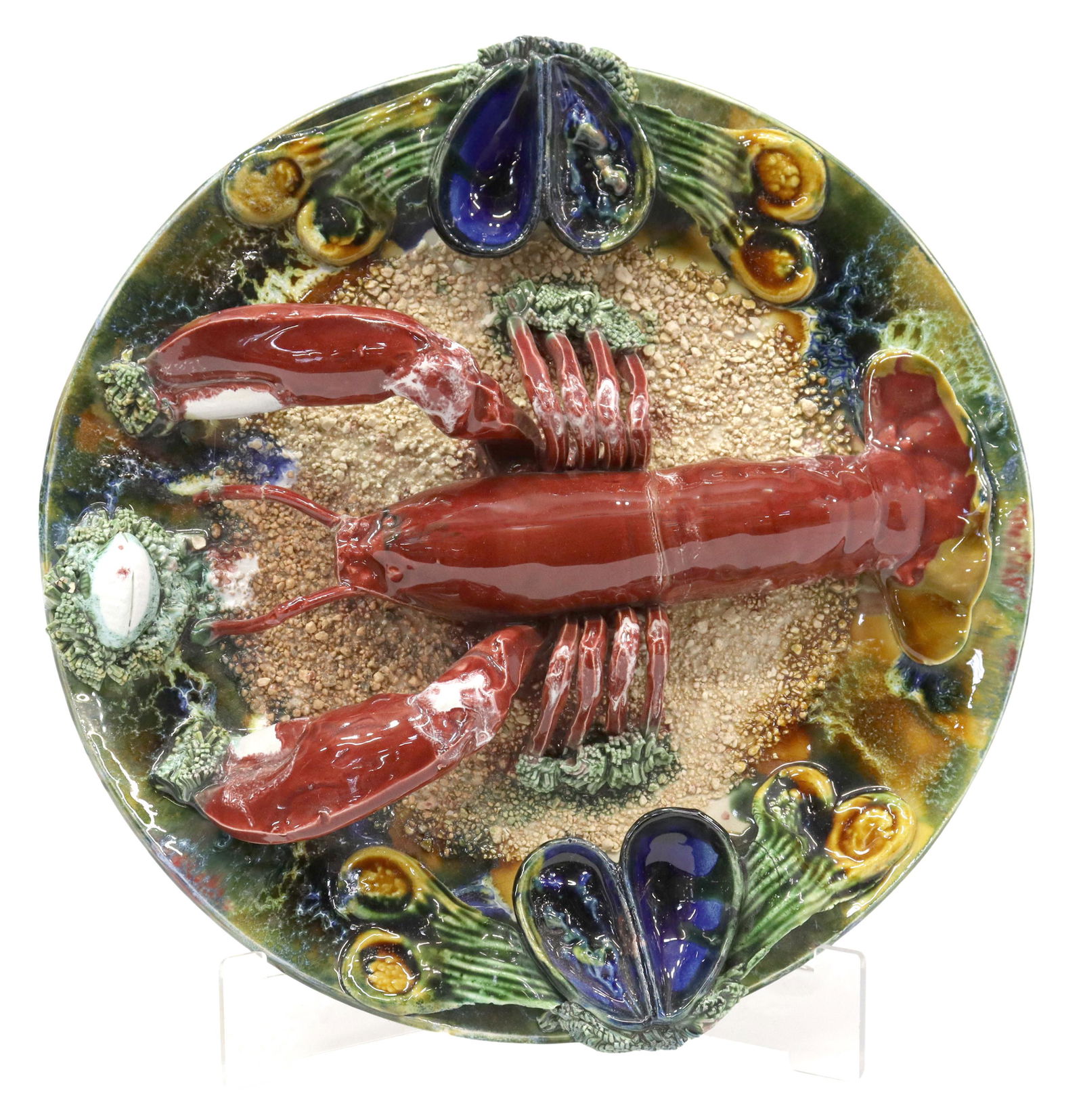 PORTUGUESE PALISSY WARE MAJOLICA LOBSTER PLATE: Portuguese Palissy ware style majolica wall plate, 20th c., with lobster, mussel shells, small chips to applied elements, restoration to one antenna, approx 12.75"diam, 5lbs Start Price: $80.00