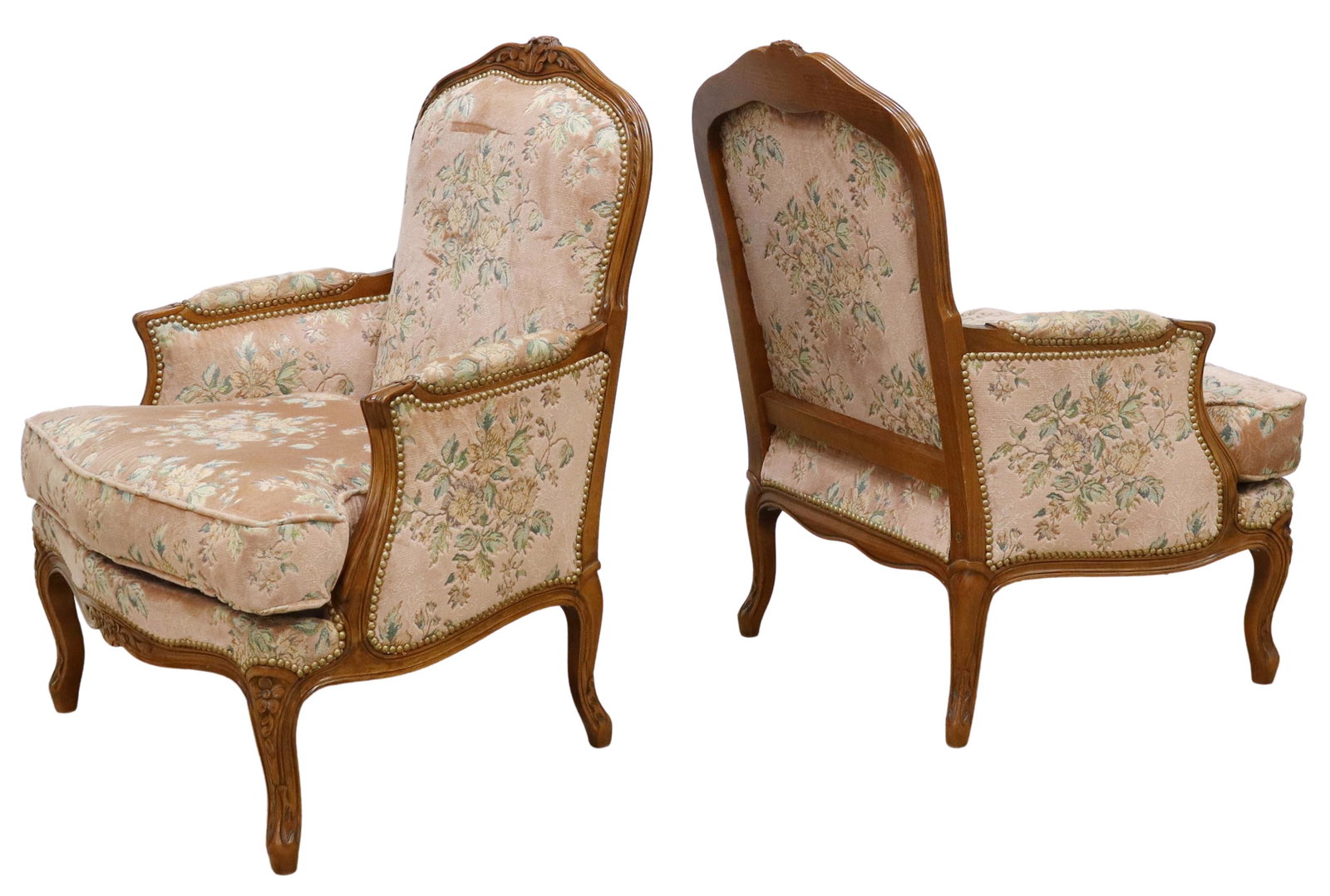 (2) FRENCH LOUIS XV STYLE UPHOLSTERED BERGERES: (pair) French Louis XV style fruitwood armchairs, 20th c., foliate carved crest, velvet upholstered back, sides, and loose seat cushion, nailhead trim, foliate carved apron, rising on cabriole legs, l