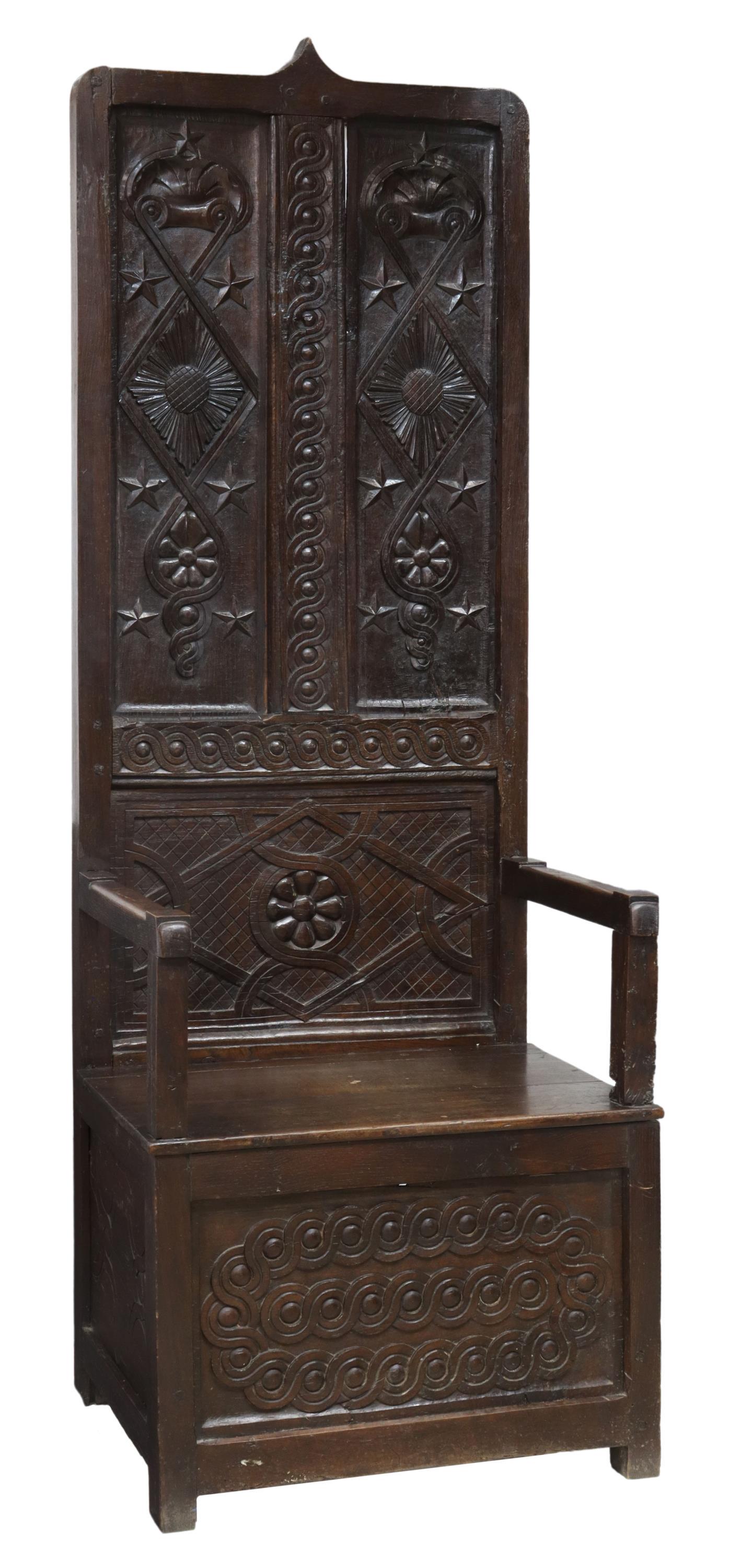 FRENCH GOTHIC REVIVAL CARVED OAK HALL BENCH: French Gothic Revival oak hall bench, 19th c., tall back with pointed crest, carved with five-pointed stars, running coin molding, plank seat, on a paneled base, approx 70"h, 24.5"w, 20.5"d Start Pric