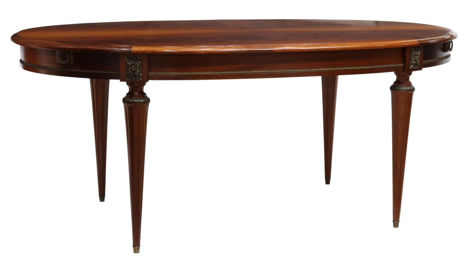 FRENCH LOUIS XVI STYLE MAHOGANY DRAW-LEAF TABLE: French Louis XVI style mahogany extension table, early 20th c., having and oval-shaped top with draw leaves, gilt metal foliate motifs and trim to apron, above tapered fluted legs, ending in metal cap