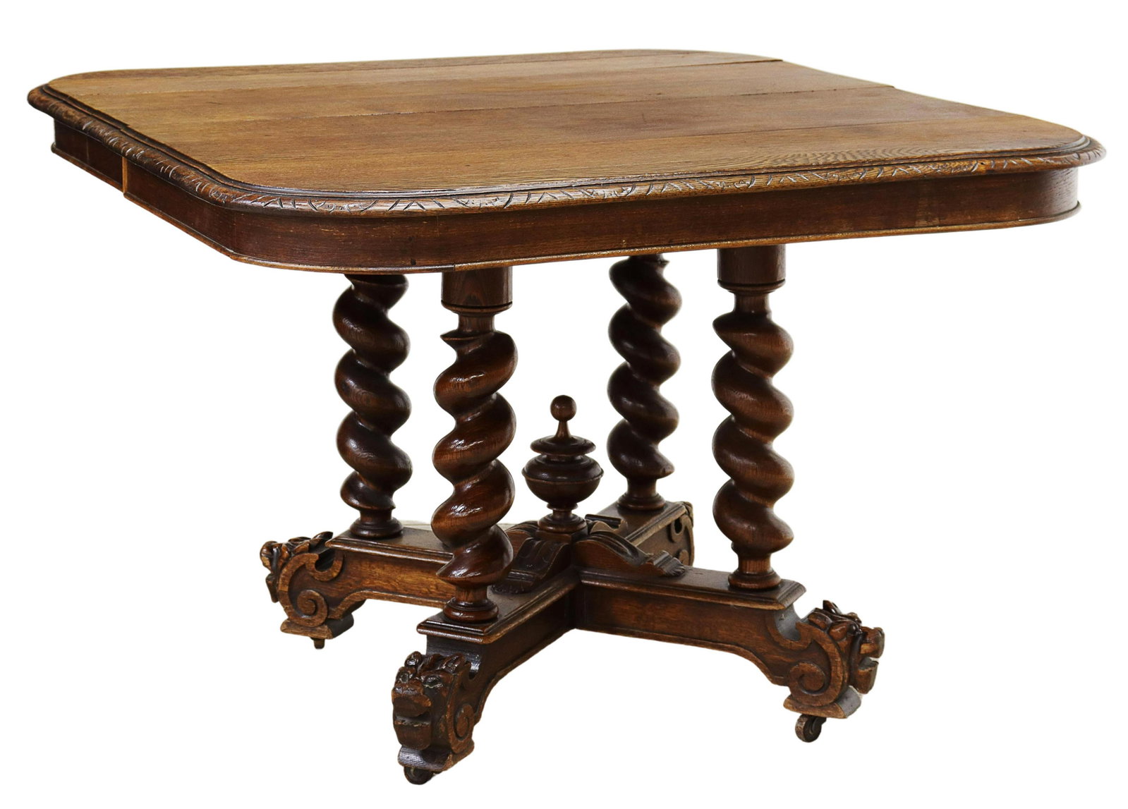 FRENCH HENRI II STYLE OAK EXTENSION TABLE: French Henri II style oak extension table, late 19th c., oblong tabletop with molded edge, rising on spiral turned legs, cross platform base with center finial, scrolled feet with mask terminals, on c