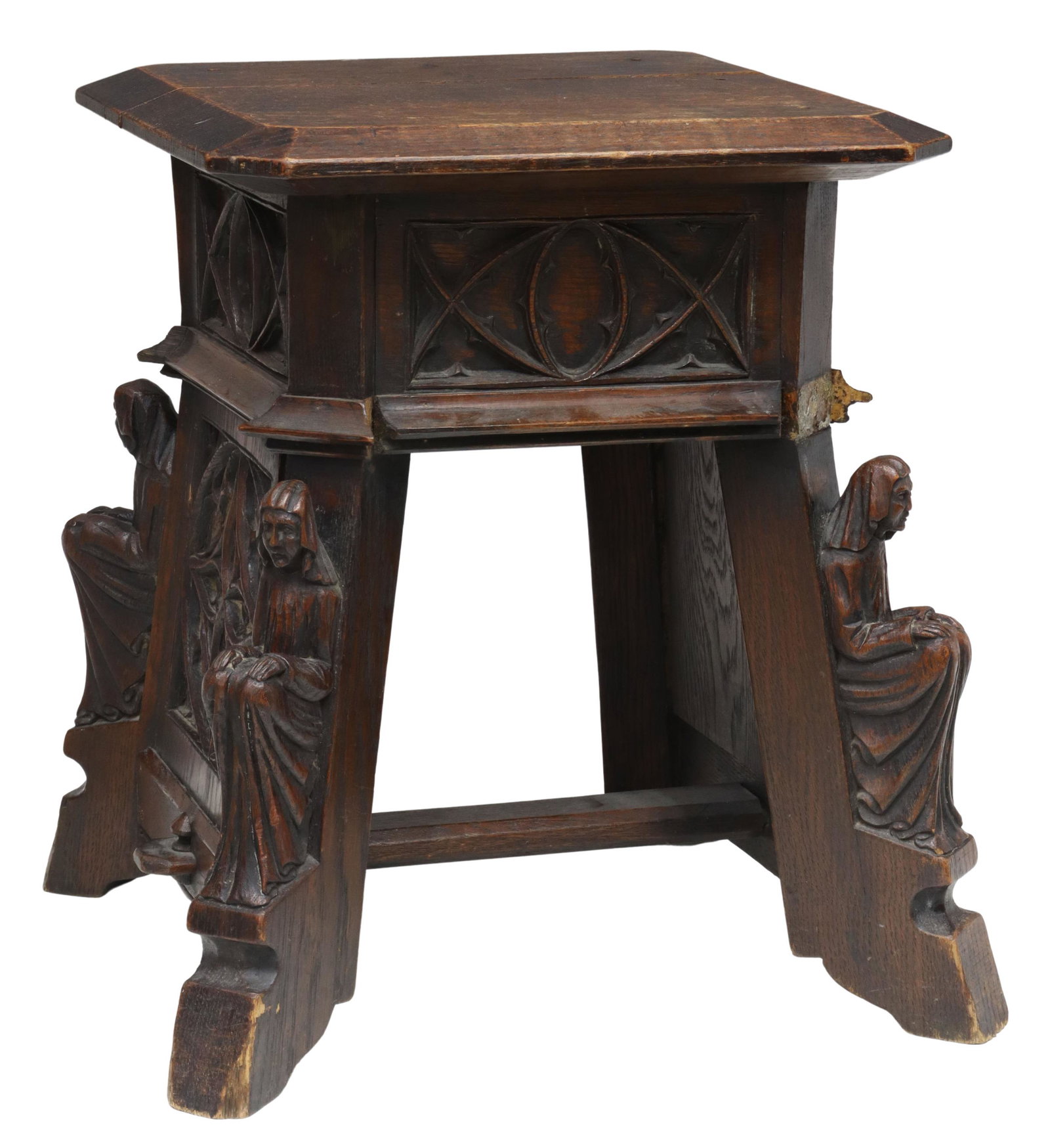 FRENCH GOTHIC REVIVAL FIGURAL-CARVED OAK STOOL: French Gothic Revival oak stool, 19th c., square top with molded edge, canted corners, apron and sides carved with tracery elements, seated veiled figures at the four corners, joined by cross stretche