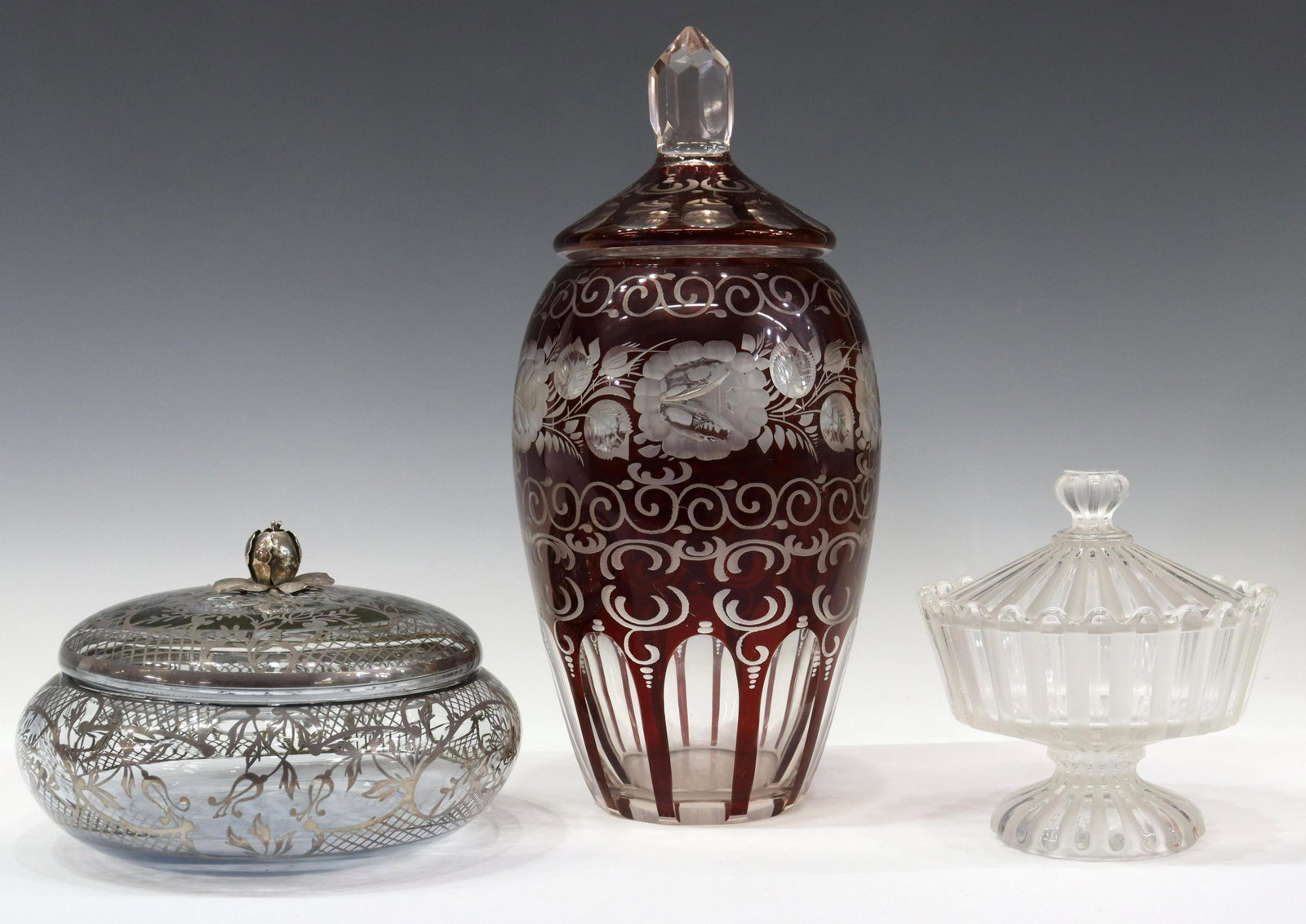 (3) BACCARAT CANDY DISH, BOHEMIAN CUT-TO-CLEAR URN: (lot of 3) Glass tableware, including: (1) French Baccarat covered candy dish, molded mark no. 4982 underfoot, approx 6"h, 5.75"diam, (1) silver overlay covered bowl, with silver (content unknown) flo