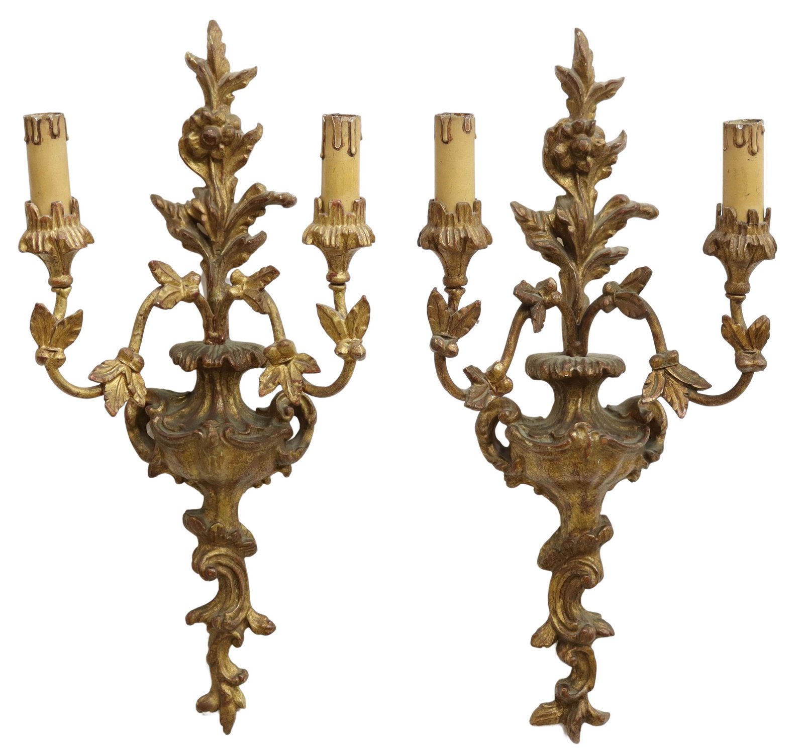 (2) ITALIAN LOUIS XV STYLE 2-LT GILTWOOD SCONCES: (pair) Italian Louis XV style giltwood sconces, 20th c., having carved fountain and floral motif wall mount supporting two foliate arms ending in petal bobeche and faux candles, in need of wiring, app