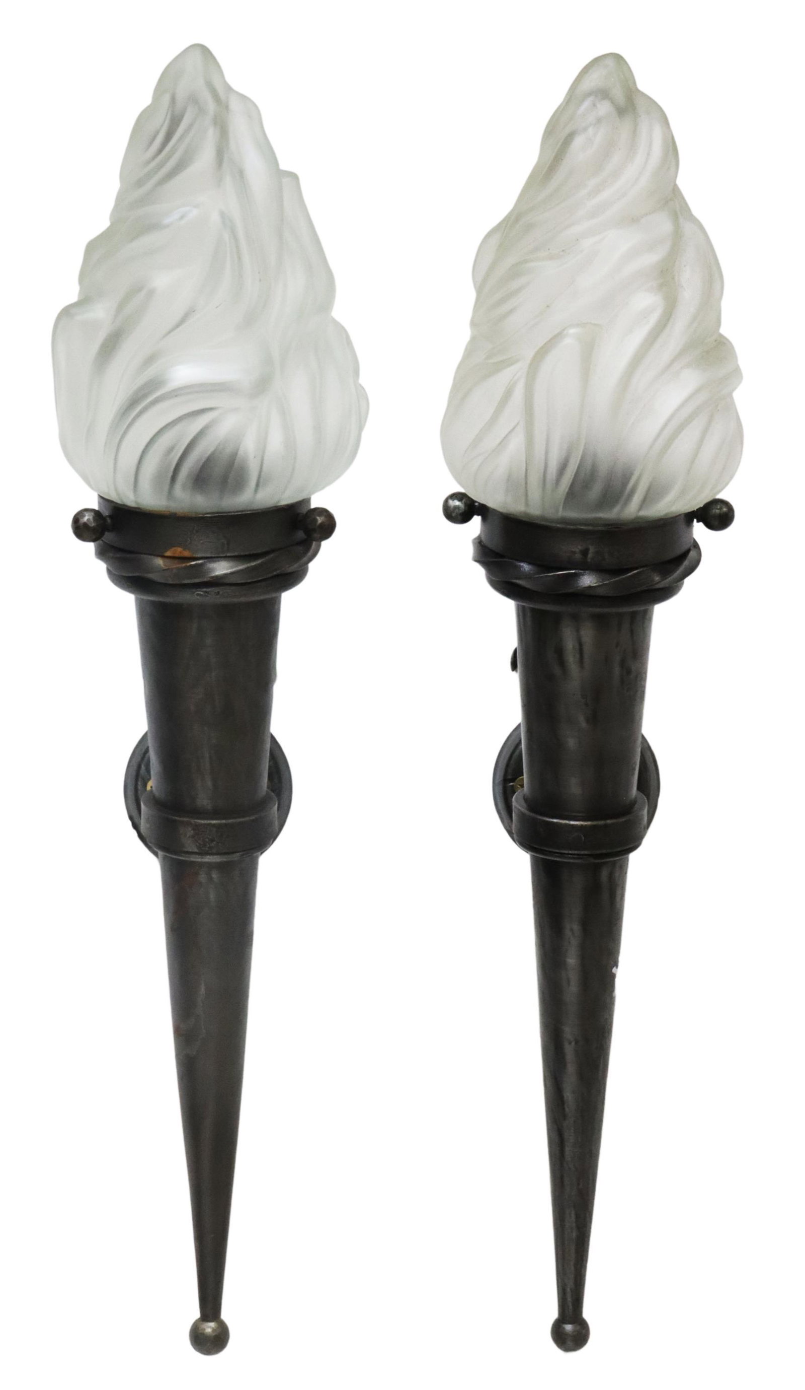(2) FRENCH IRON TORCH-FORM WALL SCONCES: (lot of 2) French iron torch-form wall sconces, in the manner of Gilbert Poillerat (French, 1902-1988), 20th c., molded glass flame shade, single light, over tapered conical support, multiple large ch