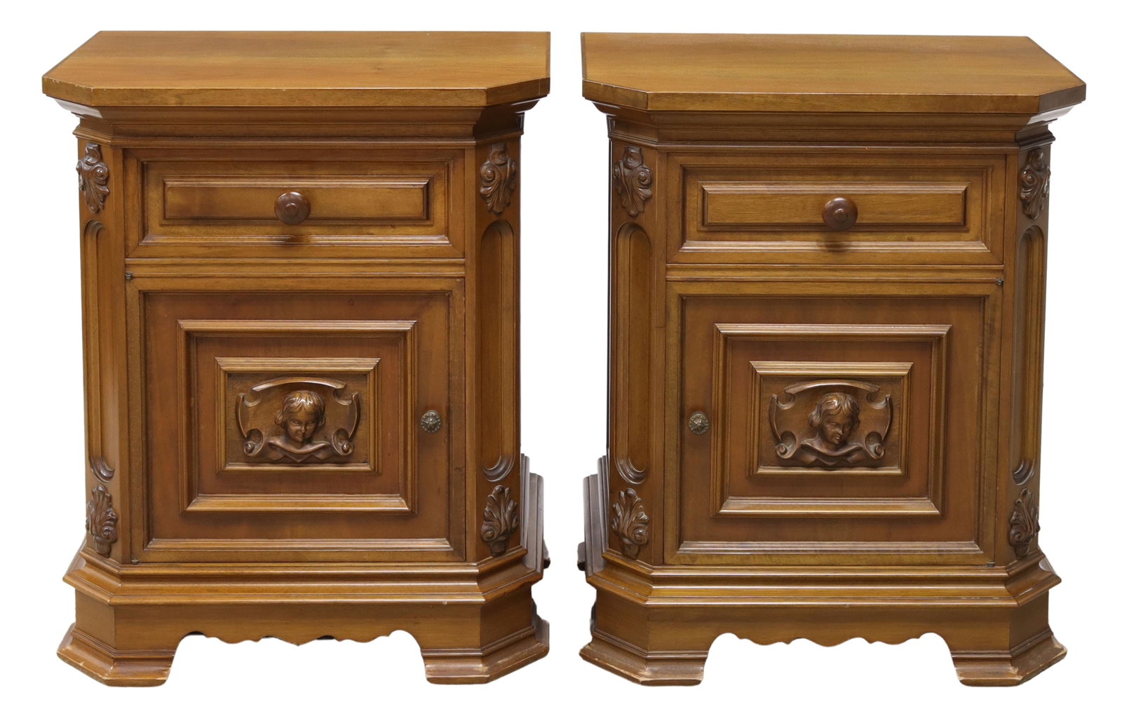 (2) ITALIAN RENAISSANCE STYLE WALNUT NIGHTSTANDS: (pair) Italian Renaissance style walnut bedside cabinets, late 20th c., each having shaped top, over case fitted with single drawer, cabinet door with protruding figural mask, carved foliate motifs, o
