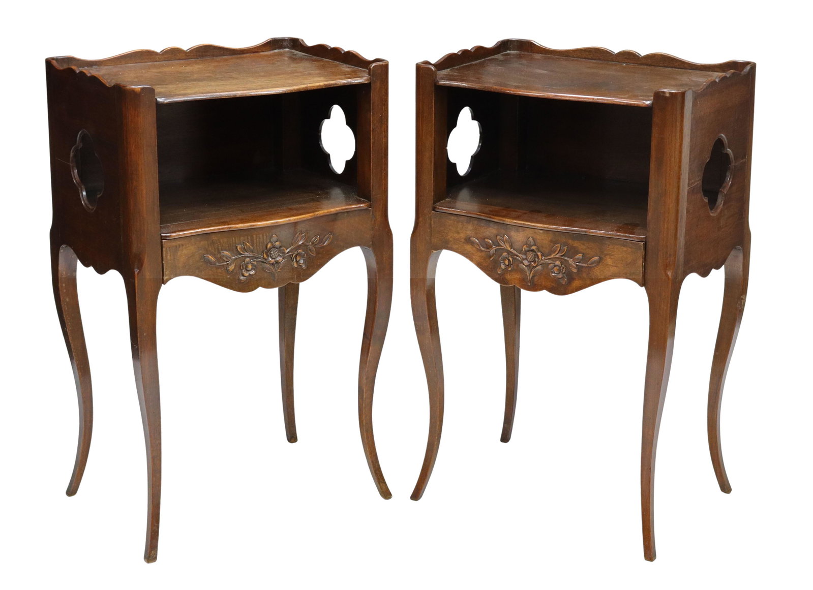 (2) FRENCH LOUIS XV STYLE WALNUT BEDSIDE CABINETS: (pair) French Provincial Louis XV style walnut nightstands, late 19th c., the top with a shaped rail over an open shelf with quatrefoil cutouts at sides, single foliate carved front drawer, rising on 