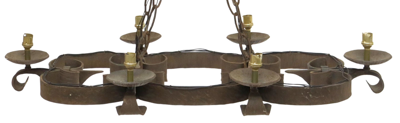 GOTHIC STYLE WROUGHT IRON SIX-LIGHT CHANDELIER: Gothic style wrought iron chandelier, early 20th c., curved frame, with fleur-de-lis shaped arms, ending in bobeches, lacking candle covers, in need of wiring, approx 6"h, 34.5"w, 19"d Start Price: $5