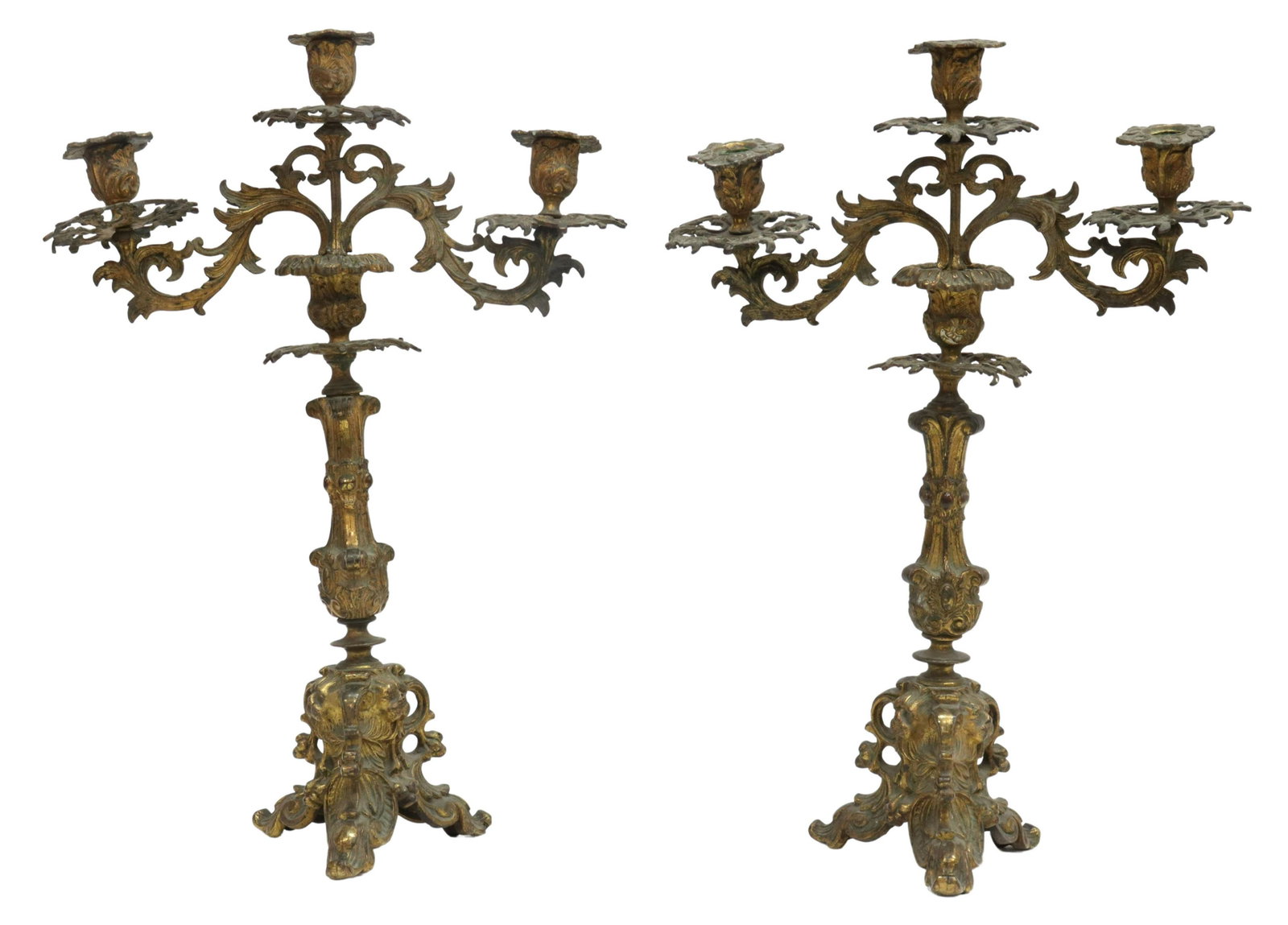 (2) ROCOCO STYLE GILT METAL CANDELABRA: (pair) Rococo style gilt metal candelabra, early 20th c., three candle sockets, removable bobeche, rocaille standard with scrolling foliates, lion's masks, rising on scroll feet, loss to gilt finish, 