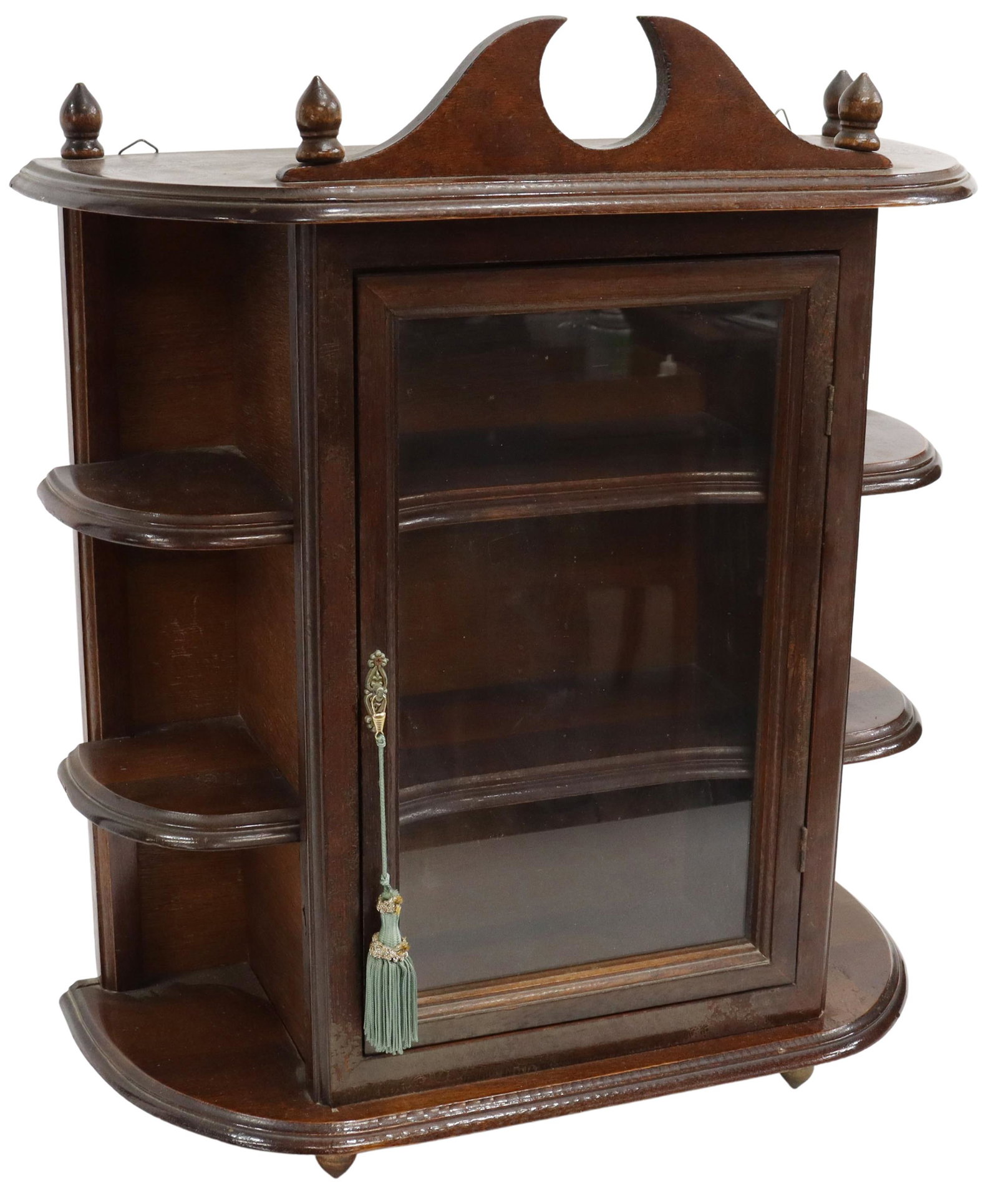 MAHOGANY WALL-MOUNTED DISPLAY CABINET: Mahogany wall-mounted display cabinet, early 20th c., split pediment, turned finials, open display shelves framing glazed cabinet door, turned drop finials, approx 23.5"h, 20"w, 8.5"d Start Price: $80