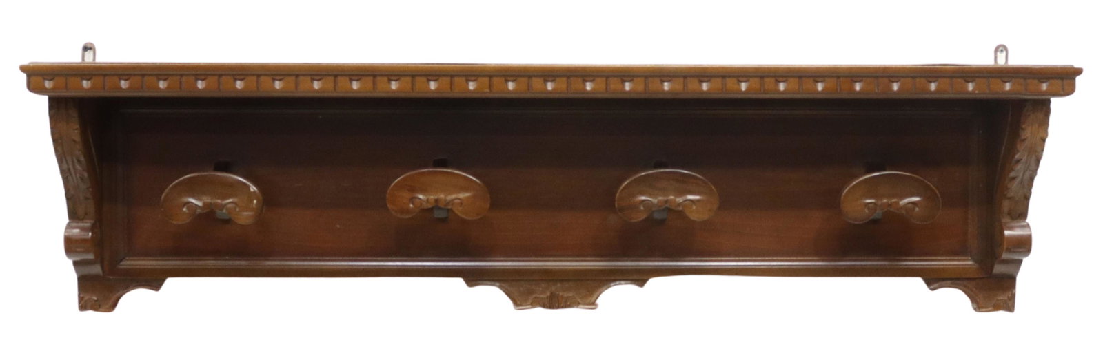 ITALIAN RENAISSANCE REVIVAL CARVED HAT RACK: Italian Renaissance Revival wall-mounted coat/ hat rack, early 20th c., rectangular top with egg-and-dart molding, over four shaped hooks, flanked by foliate corbels, approx 12"h, 47.5"w, 7.5"d Start 