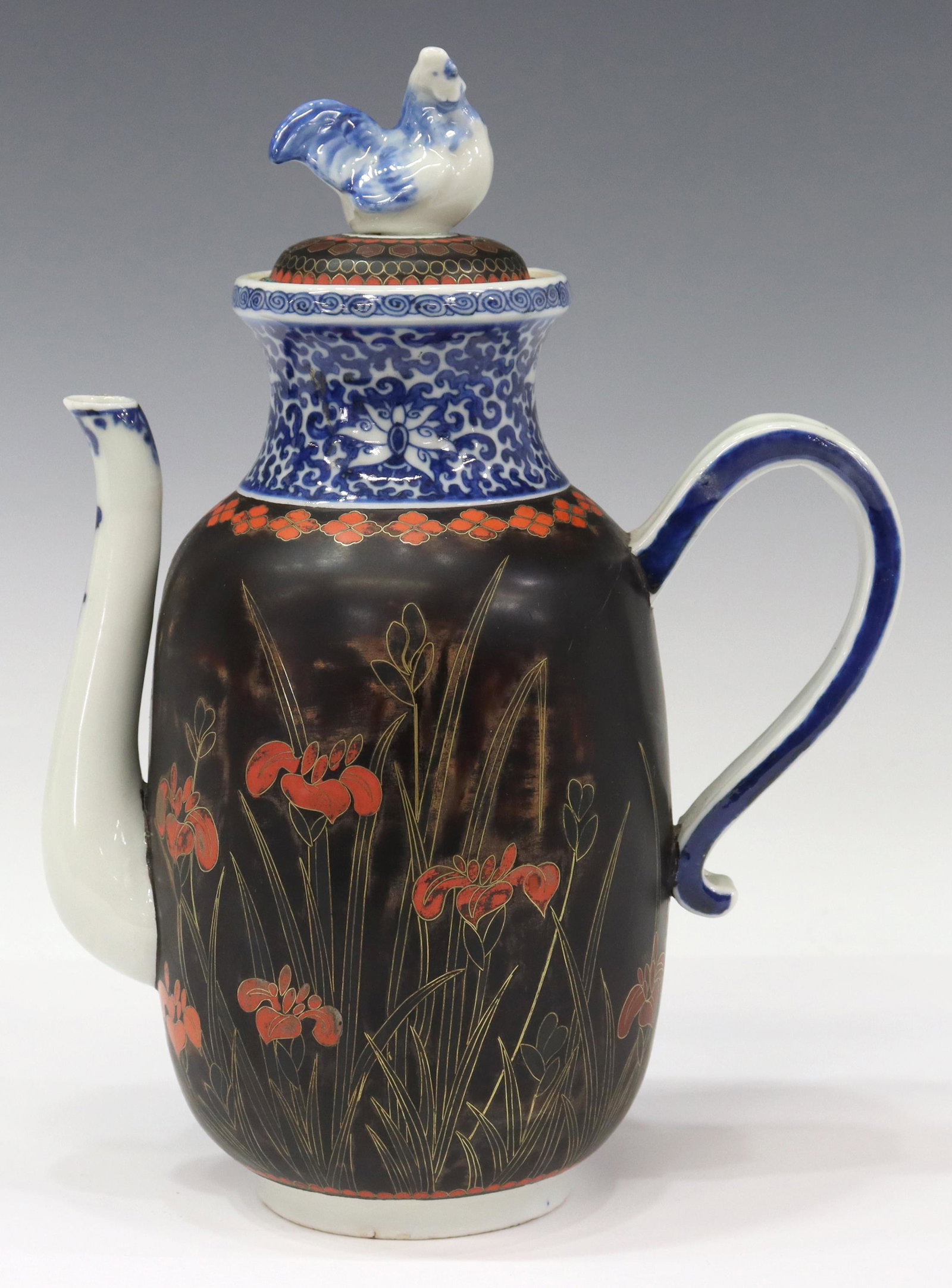 JAPANESE MEIJI PERIOD TOTAI SHIPPO COFFEE POT: Japanese cloisonne decorated porcelain (totai shippo) coffee pot, Meiji period (1868-1912), domed lid with hen finial, blue glazed lotus scroll band, cloisonne decorated body with irises and other flo