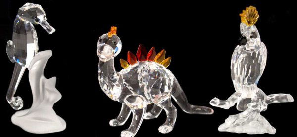 SWAROVSKI CRYSTAL FIGURES, RETIRED DINO, COCKATOO: (lot of 3) Group of Swarovski crystal figures comprising: Swarovski "Silver" crystal Cockatoo from the Feathered Beauties Series, designed by Heinz Tabertshofer, 3.25"h; Seahorse on a frosted wave des