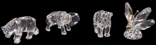 COLLECTION OF SWAROVSKI CRYSTAL ANIMIAL FIGURES: (lot of 4) Swarovski crystal sculptures including: the large Butterfly, 2"h; Little Elephant, 1.5"h; Brother Bear and Sister Bear, both designed by Elisabeth Adamer, 2 3/16"h; box: 4.75"h, 3.25"diam, 