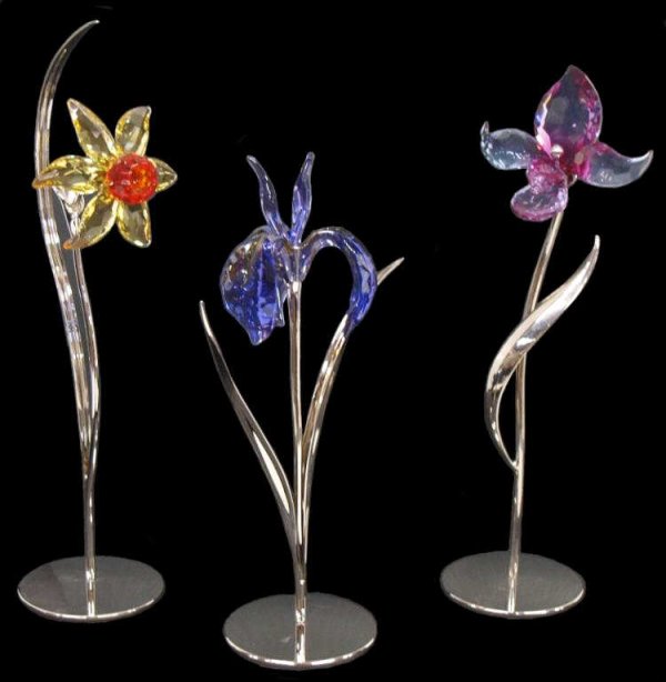 (3) SWAROVSKI CRYSTAL STANDING FLOWER SCULPUTES: (lot of 3) Swarovski crystal standing flower sculptures designed by Yasmine Hurel, each on a removable metal base, including: the Damboa iris flower in faceted blue violet crystal, 8"h; the Dacali flo