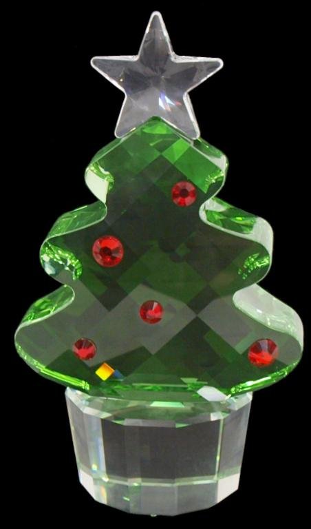 LARGE SWAROVSKI FELIX CHRISTMAS TREE, RETIRED: Swarovski crystal Felix the Christmas Tree sculpture in the large size, a colorless star surmounting the tree in green with applied red 'ornaments', on a clear circular base, designed by Eva Maria Rie
