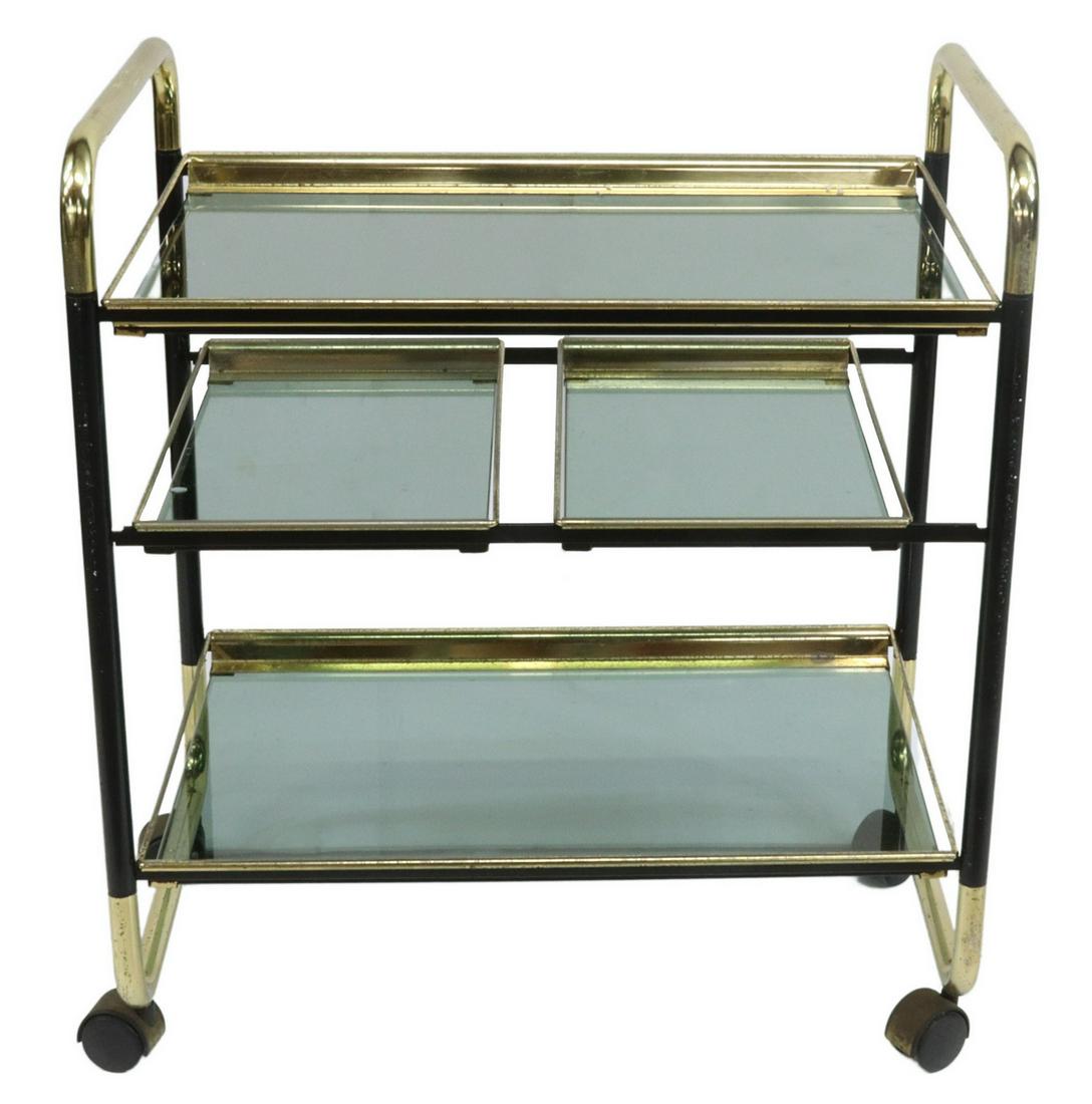 VINTAGE ITALIAN MODERN SMOKED GLASS SERVICE CART: Vintage Italian modern service cart, c.1970s, having gilt and black metal tube frame, fitted with four removable smoked glass shelves, moving on casters, approx 26"h, 25.75"w, 15.75"d Start Price: $10