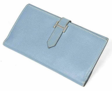 HERMES 'BEARN' BLUE EPSOM LEATHER WALLET: Hermes "Bearn" wallet, in light blue Epsom leather, with palladium-plated hardware, interior bill compartments, zip coin compartment, card slots, pull-through strap closure with H logo, creasing, wear