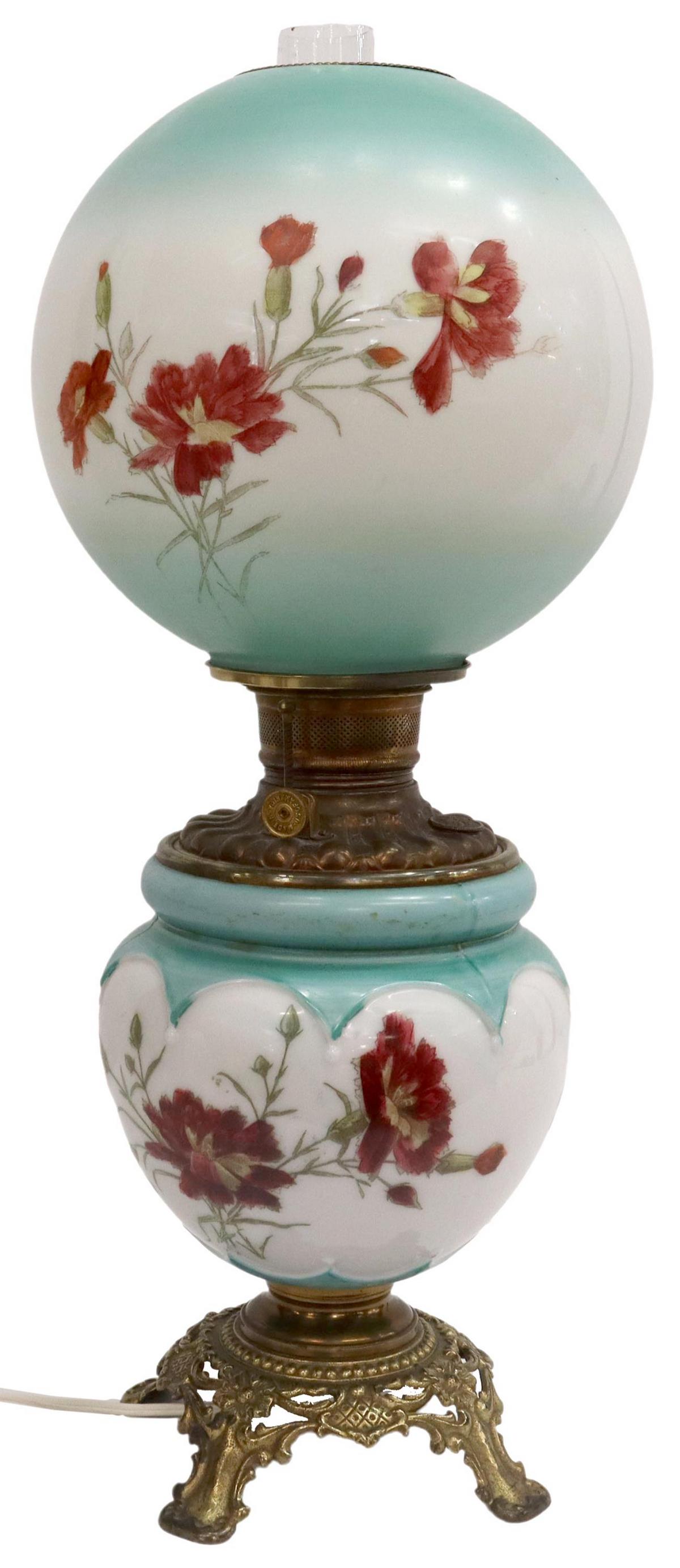 'GONE WITH THE WIND' CONVERTED BANQUET LAMP: Victorian "Gone With The Wind" kerosene/ oil banquet lamp, now electrified, decorated with floral motifs, rising on openwork foliate base, small chips to bottom of globe, approx 24"h, 7lbs Start Price