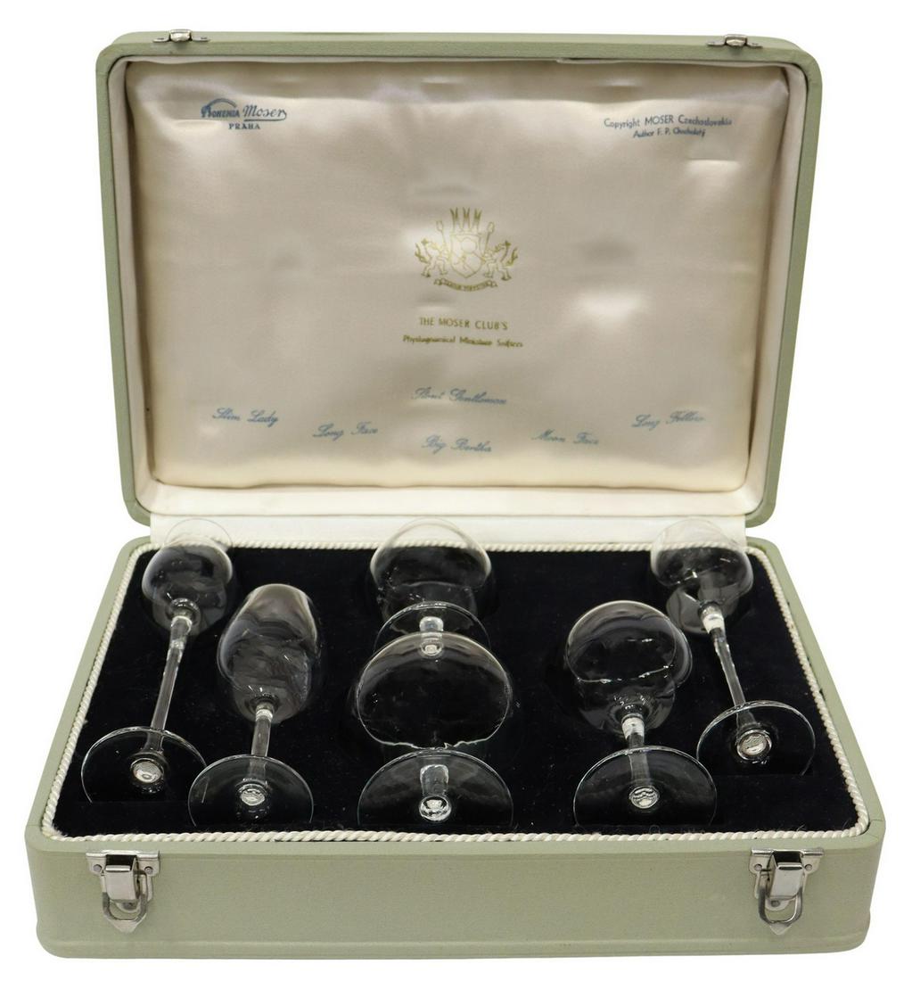 MOSER CLUB'S PHYSIOGNOMICAL TOASTING SNIFTERS SET: The Moser Club's Physiognomical Toasting Snifters Glass Set, 20th c., Moser-Karlsbad, Prague, Czechoslovakia, design by F. P. Chocholaty, retaining branded case, including: (six) glasses: (one) Slim L