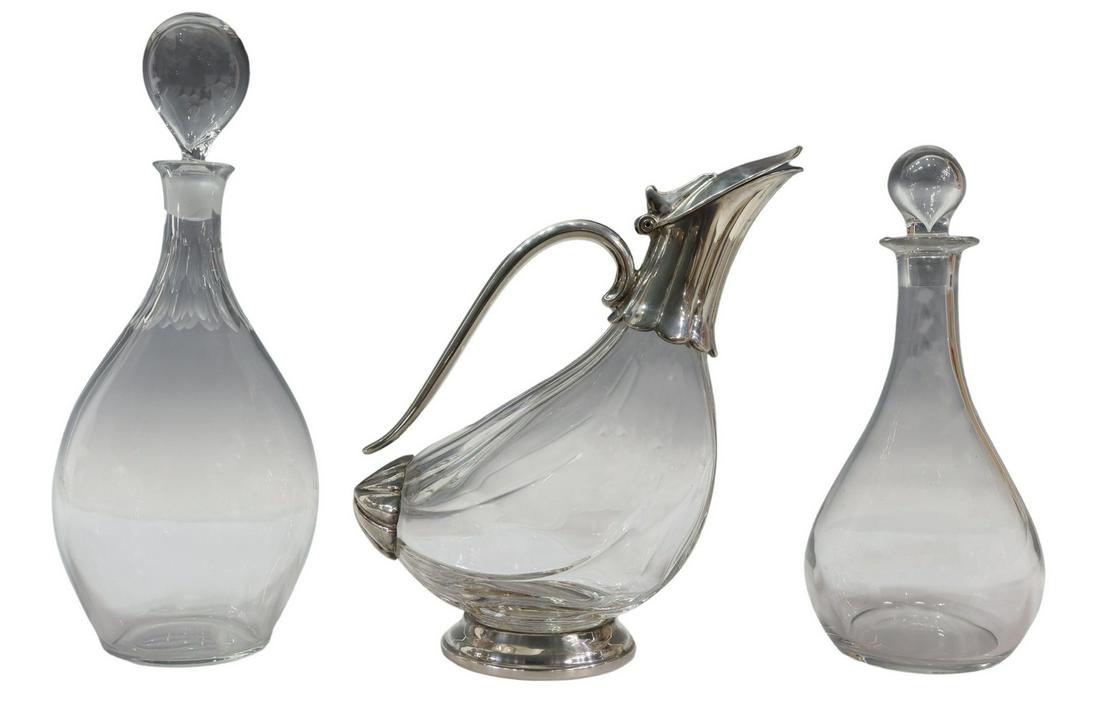 (3) CRYSTAL LIQUEUR DECANTERS & CLARET WINE JUG: (lot of 3) Crystal liqueur decanters, including: (1) Val St Lambert "Gevaert" decanter and stopper, engraved mark underfoot, approx 9.5"h, 4.5"diam, (1) decanter and stopper, with vertical cuts at the