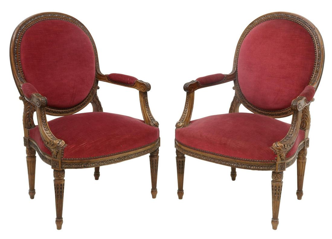 2) FRENCH LOUIS XVI STYLE MEDALLION-BACK FAUTEUILS: (pair) French Louis XVI style armchairs, late 19th c., carved frame with beaded and acanthus molding, upholstered medallion back and seat, with tack trim, rising on tapered fluted legs, approx 38.25"h