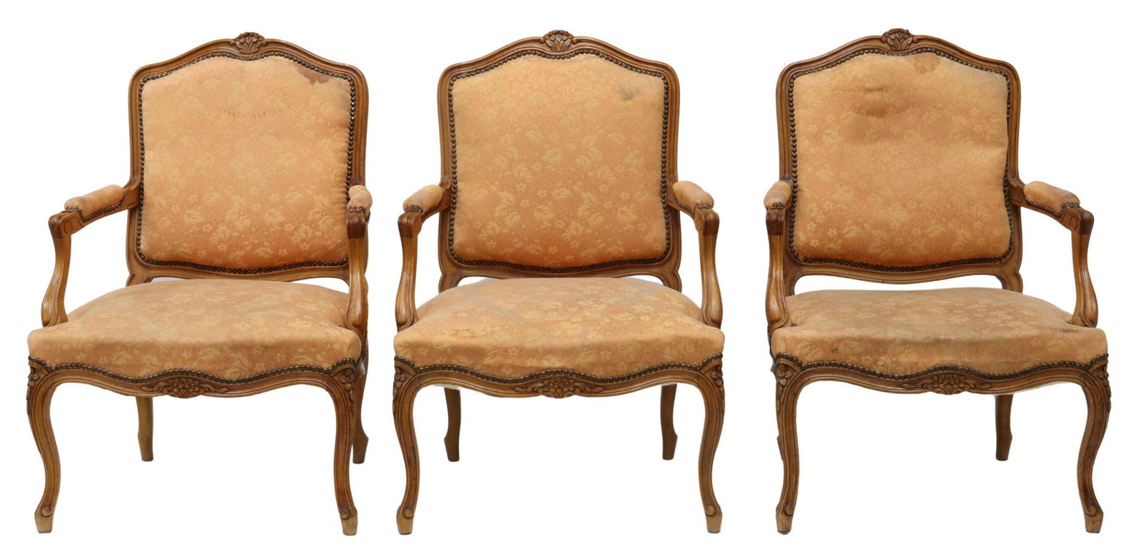 (3) FRENCH LOUIS XV STYLE UPHOLSTERED FAUTEUILS: (lot of 3) French Louis XV style armchairs, early 20th c., frame with floral carved crest, padded back, seat, and armrests, with tack trim, rising on cabriole legs, staining to upholstery, approx 37.2