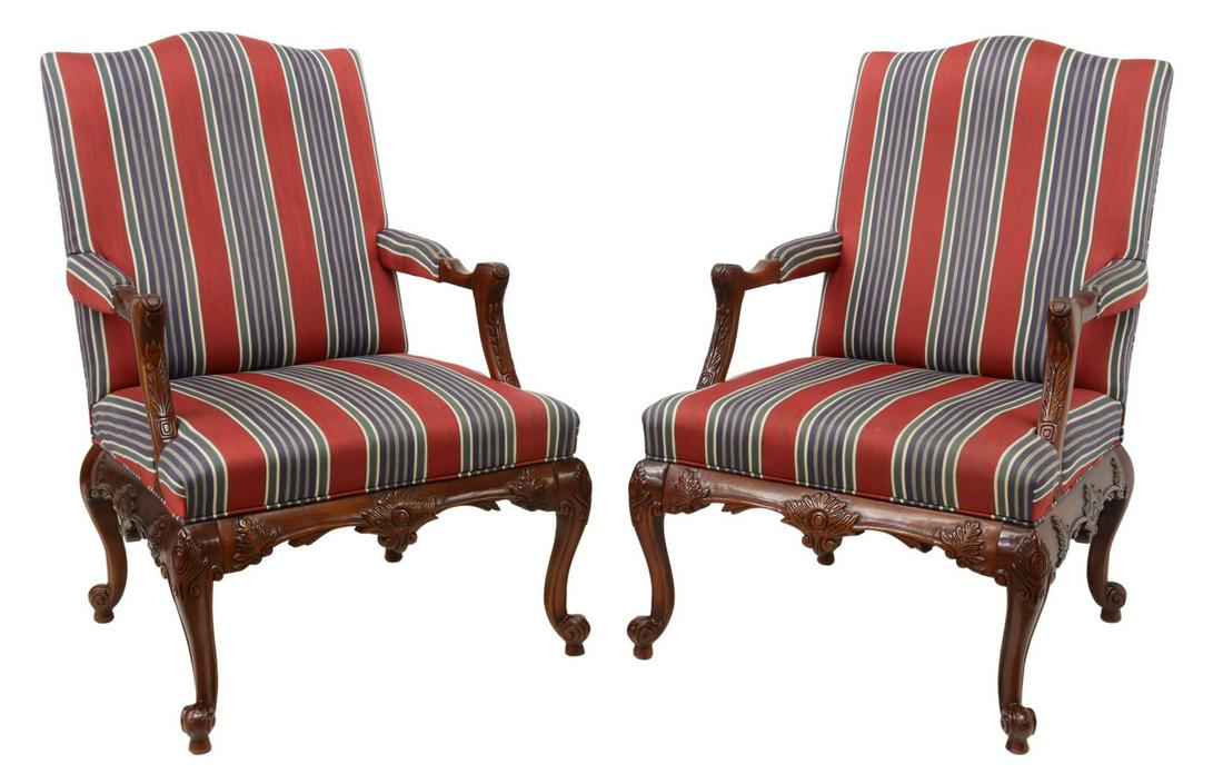 (2) STATESVILLE CHAIR CO. UPHOLSTERED ARMCHAIRS: (lot of 2) Statesville Chair Company upholstered armchairs, North Carolina, late 20th c., having curved back with striped upholstery, carved handholds, foliate carved apron, rising on cabriole legs, e