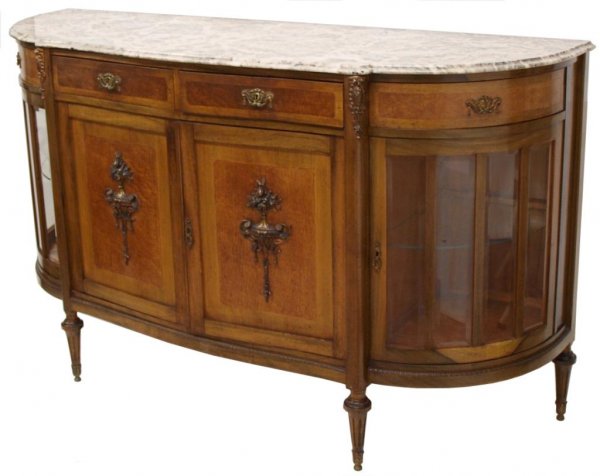 LOUIS XVI STYLE MARBLE TOP DEMILUNE CABINET: Spanish Louis XVI style walnut demilune cabinet, c. 1920, conforming marble top resting on the metal mounted case of D-form, housing two central drawers above a pair of doors mounted with torches, cur