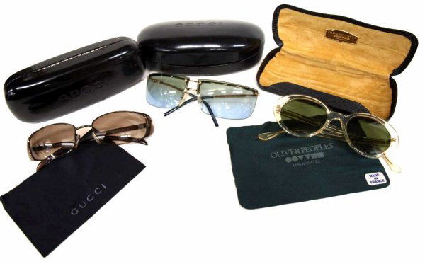 DESIGNER LADIES SUNGLASSES, GUCCI & OLIVER PEOPLES: (lot of 3) Designer ladies sunglass group, comprising: (2pr) by Gucci including model GG 658/S and GG 2653/S, each stored in black Gucci hard cases, one with Gucci cleaning cloth, like new condition,