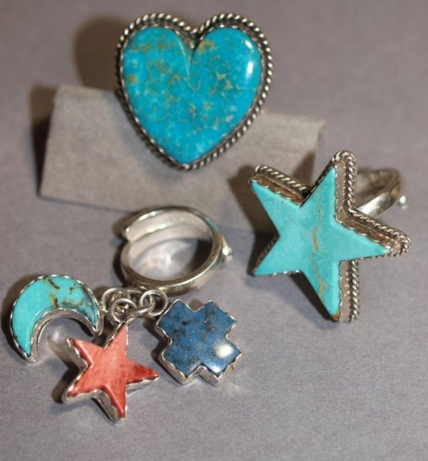 JEWELRY: JOAN SLIFKA STERLING & STONE RING GROUP: (lot of 3) Joan Slifka Designs sterling silver ring group including, (1) heart, dated 11/93, (1) star, and (1) dangle ring with heart, moon, and cross, varied semi-precious stones turquoise, lapis,etc