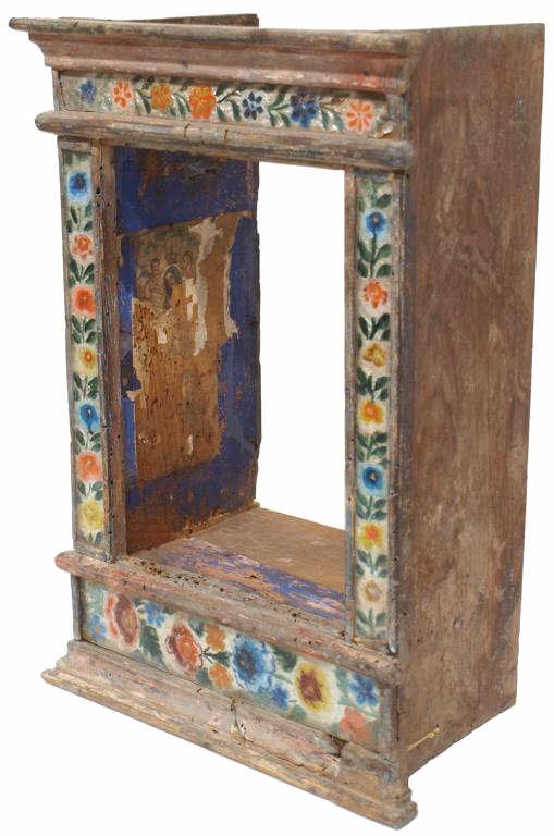 ANTIQUE RELIGIOUS CARVED WOO ALTAR NICHO, MEXICO: Carved wood altar nicho trimmed with reverse painted glass and silver foil, Mexico, 19th c., the interior featuring remnants of religious prints, one dated 1900, condition consistent with age, 16"h, 1