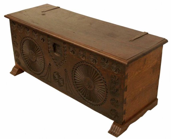 ANTIQUE SPAIN FLORAL CARVED STORAGE CHEST / TRUNK: Spanish lift top storage chest, early dovetailed case with geometric and floral carving, rising on carved feet, lacking lock, restorations, 22"h, 53"w, 19"d
