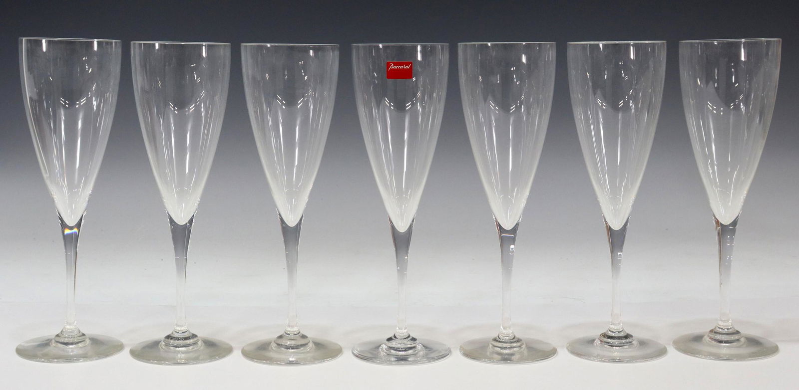 7) BACCARAT DOM PERIGNON CRYSTAL CLARET WINE STEMS: (lot of 7) French Baccarat "Dom Perignon" crystal claret wine stems, tapered bowl, plain stem, circular foot, all with acid-etched marks underfoot, approx 8.25"h, 2.75"diam; 2lbs total Start Price: $1