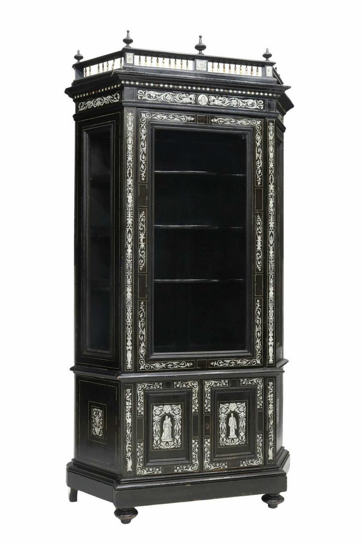 ITALIAN MILANESE BONE-INLAID EBONIZED CABINET: Italian Milanese Renaissance Revival display cabinet, 19th c., ebonized case with contrasting bone inlay, turned finials, spindled gallery, glazed door and side panes, serpentine-front interior shelve