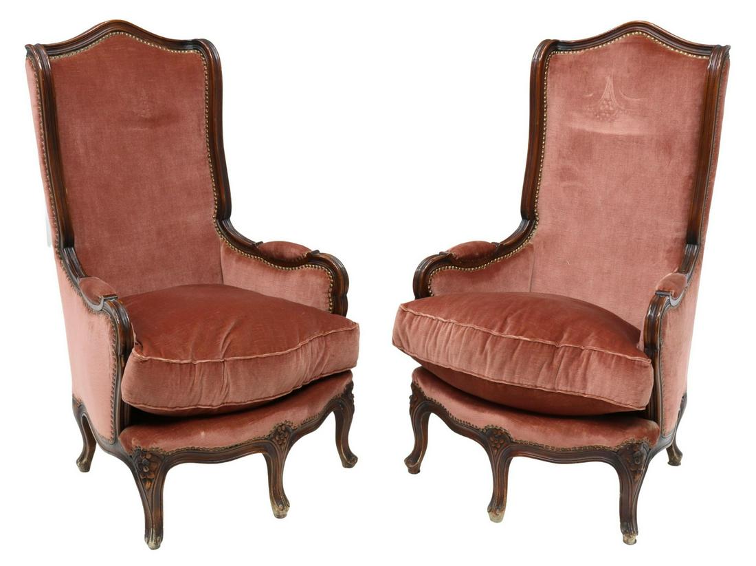 (2) ITALIAN LOUIS XV STYLE TALL WINGBACK BERGERES: (pair) Italian Louis XV style wingback armchairs, 20th c., having carved mahogany finish frame, arched back and shallow wings, over padded back, seat, and arms, loose seat cushion, velvet upholstery f