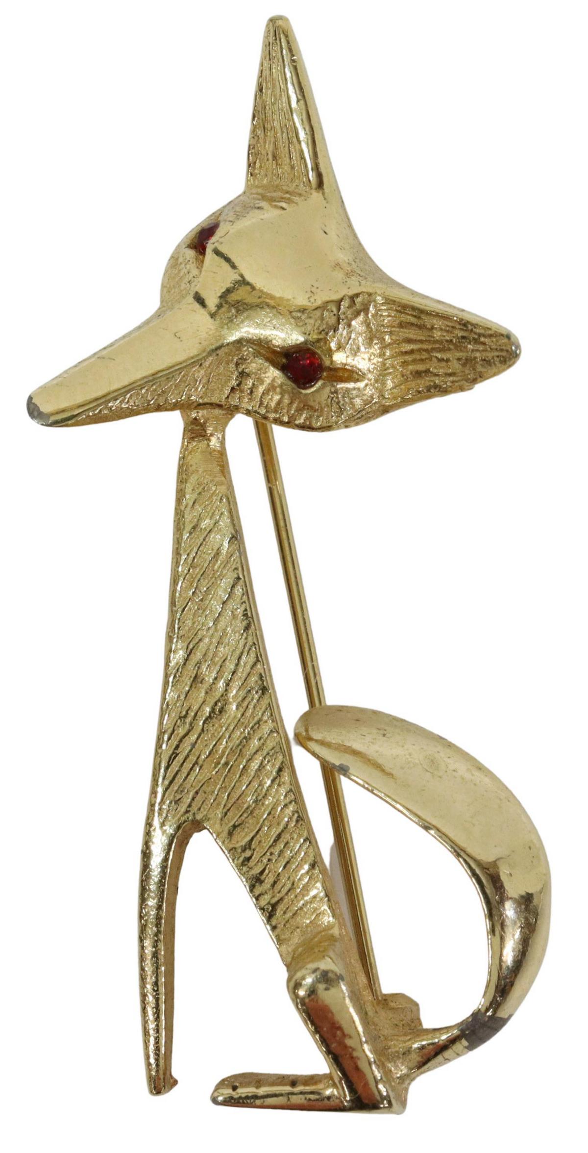 ESTATE RETRO 14KT YELLOW GOLD FOX BROOCH PIN: Estate 14kt yellow gold (tested) brooch/ pin, c.1950s-1960s, seated fox, with red eyes, textured fur, repair to tail, approx 2.25"h, 1"w, 8.5 grams (inclusive of all materials) Start Price: $150.00