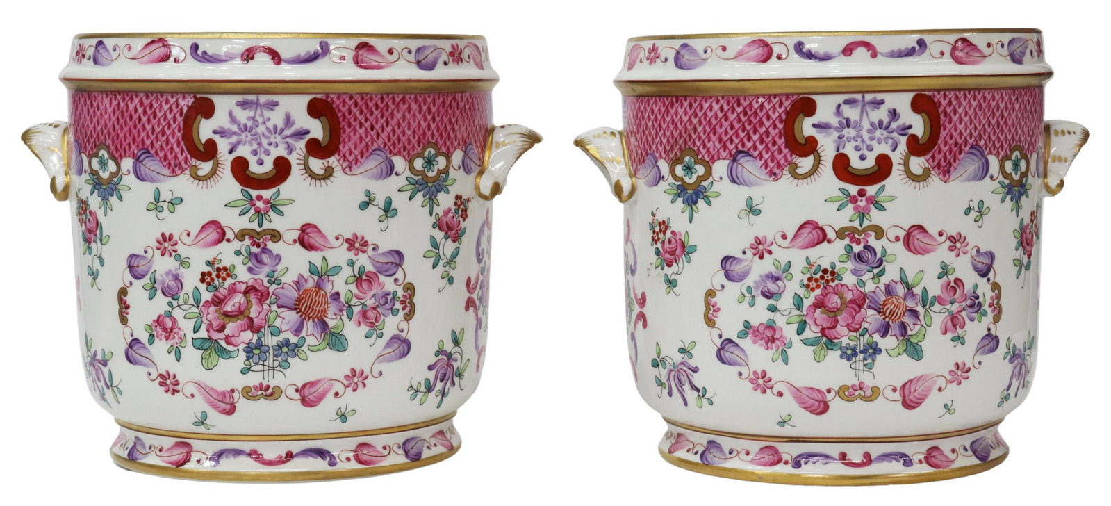 (2) FRENCH PARCEL GILT PORCELAIN WINE COOLERS: (pair) French parcel gilt porcelain wine coolers/ cache pots, 20th c., with dual foliate-form handles, pink and purple flowers on white ground, rising on circular foot, Porcelaine de Paris crossed arr