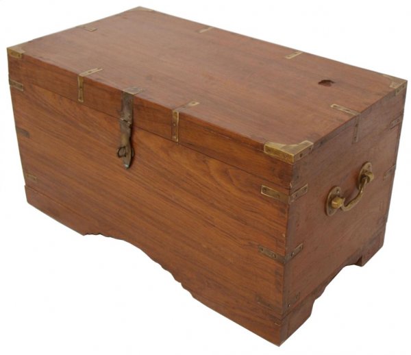 BRITISH COLONIAL BRASS BOUND TEAKWOOD TRUNK: British Colonial teakwood storage chest, 19th c., the diminutive rectangular trunk with brass bindings and side handles, fitted interior with floral carved compartments, central lift out tray revealin