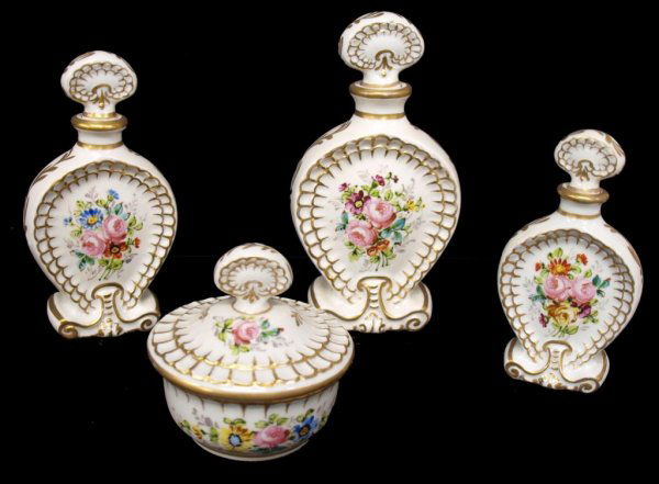 SEVRES STYLE FLORAL PAINTED PORCELAIN DRESSER SET: (set of 4) Sevres style porcelain dresser set comprising (3) bottles of graduated size and (1) lidded jar, parcel gilt and hand painted in a floral motif, blue mark underfoot, largest bottle: 8"h, 4"w