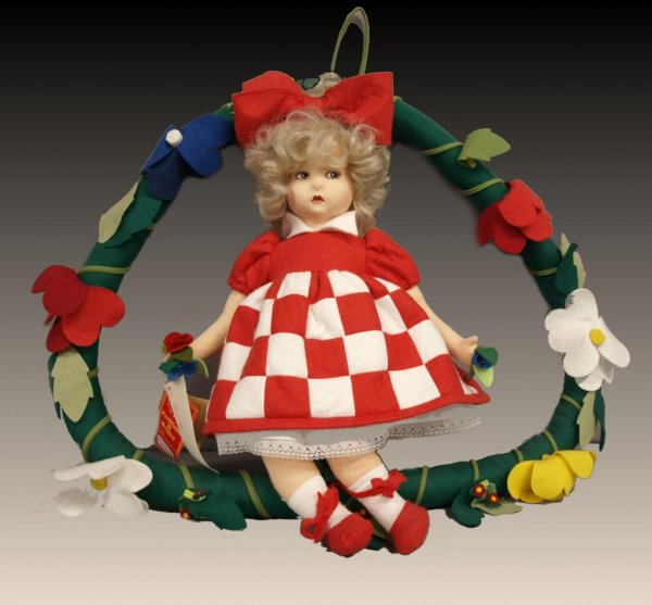 LARGE ITALIAN LIMITED LENCI LOGO DOLL IN WREATH: Italian La Lenci Logo felt doll, numbered 283/499 at neck, with felt wreath, retaining Italian tags, 22"d in wreath, doll 18"h, 1lb