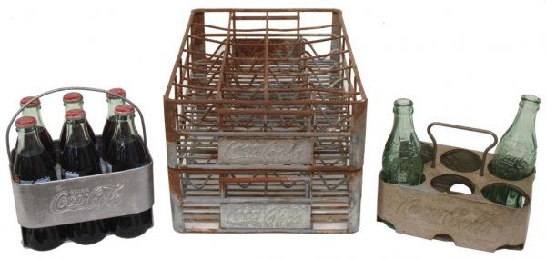 VINTAGE COCA-COLA BOTTLE CARRIERS WITH BOTTLES: (lot of 4) Vintage Coca-Cola bottle carriers in metal: (1) 'Drink Coca-Cola' holding six full bottles, 9.5"h, 7.5"l, 4.75"w; (1) 6-pack carrier with numerous dents, 'Coca-Cola', holding two green bott