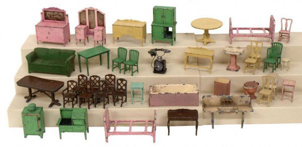 VINTAGE MINIATURE TOOTSIE TOY DIE CAST FURNITURE: (38 pieces) Tootsie Toy miniature furniture including vanity, beds, couches, sink, toilet, side tables, dining tables, chairs, rocker, buffet, stoves, kitchen cabinets, etc., much wear to paint, mirro