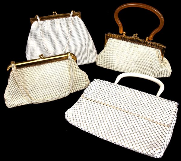 GROUP WHITING & DAVIS ENAMELED MESH PURSES: (lot of 4) Vintage Whiting & Davis white and cream enameled mesh bags, each with lined interior, varied style and design, some staining to liners, wear with age, largest: 7"h, 9.5"w, 3.25lbs total