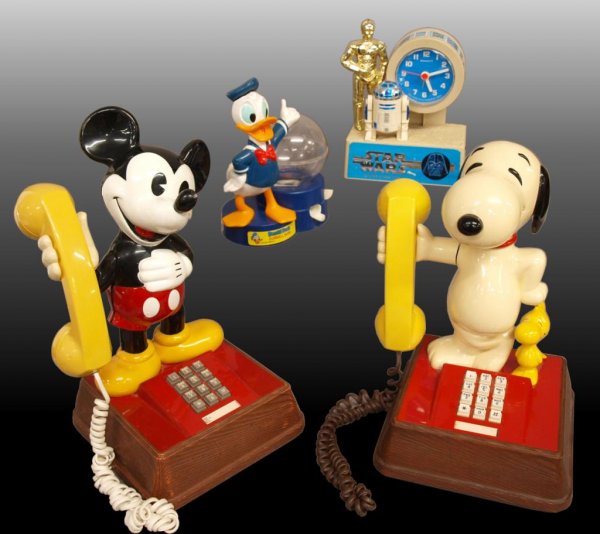 MICKY MOUSE, SNOOPY & STAR WARS COLLECTIBLES: (lot of 4) Collectible Disney and Peanuts grouping, including: (2) American Telecommunications Corporation telephones, (1) 1976 Mickey Mouse, 15"h and (1) Snoopy & Woodstock, hairline on arm, 13"h; (1