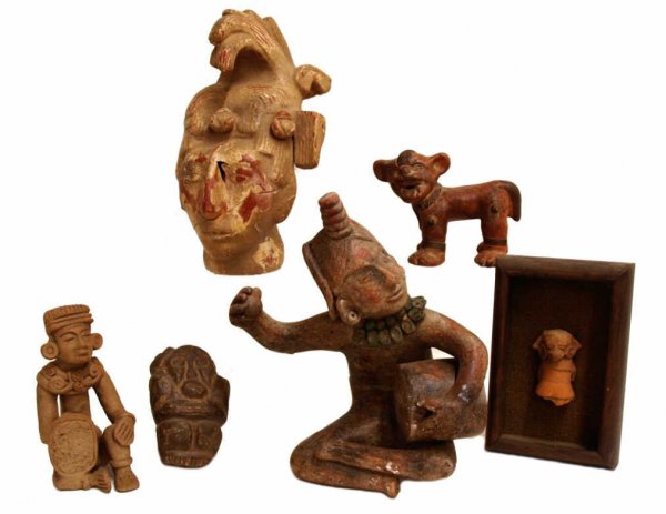 LOT PRE-COLUMBIAN STYLE CLAY & STONE FIGURES: (lot of 7) Collection of Pre-Columbian style clay and stone figures: (1) possum god figure mounted in a deep wood frame, figure: 3.5"h; (1) large seated figure playing drum, 12.5"h, 12"w; (1) Mayan st
