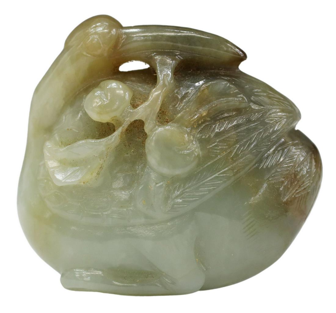 CHINESE CARVED JADE GOOSE & FRUIT BRANCH ORNAMENT: Chinese carved jade ornament, goose with fruit branch, pale green with russet inclusions, will require a stand to sit upright, approx 2"h, 2.25"w, 1"d, 98.9 grams Start Price: $80.00