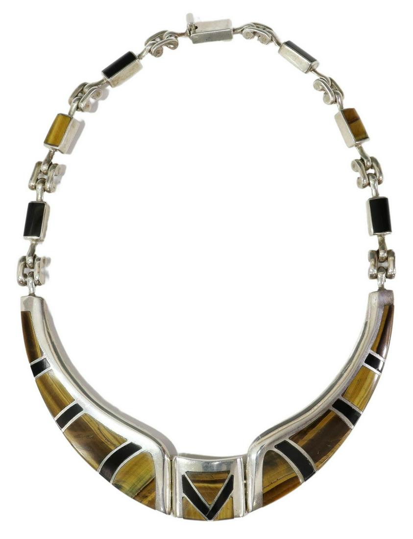 MEXICO MODERNIST 950 SILVER & TIGER'S EYE NECKLACE: Modernist 950 silver collar necklace, Mexico, set with tiger's eye and onyx, box clasp, approx 17.5"l, 135.5 grams (inclusive of all materials) Start Price: $80.00
